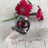 Chase and Scout Jewelry Double Snake Ring in Sterling and Garnet red flower in beckground
